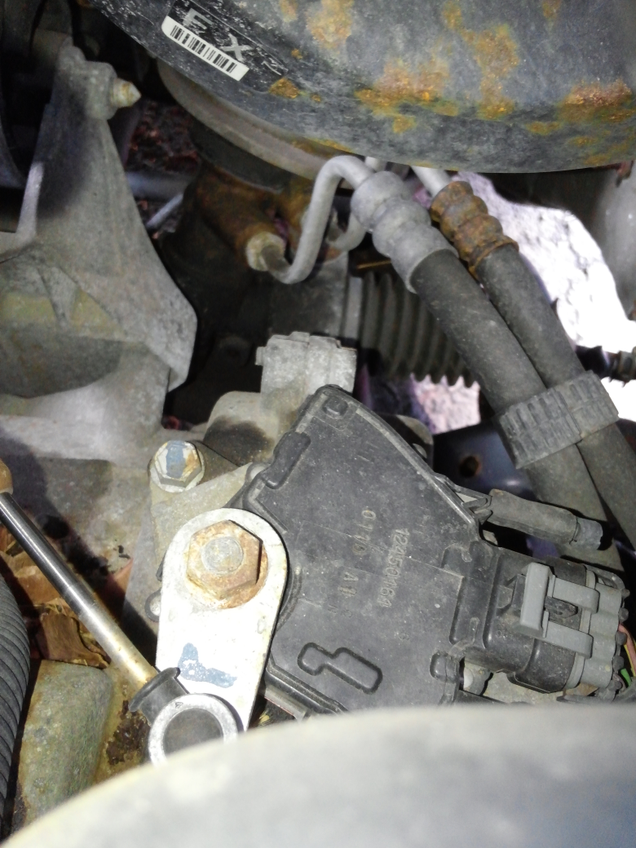 You can see the replaced line connection toward the top of the picture. However, there is no fluid residue around the line.